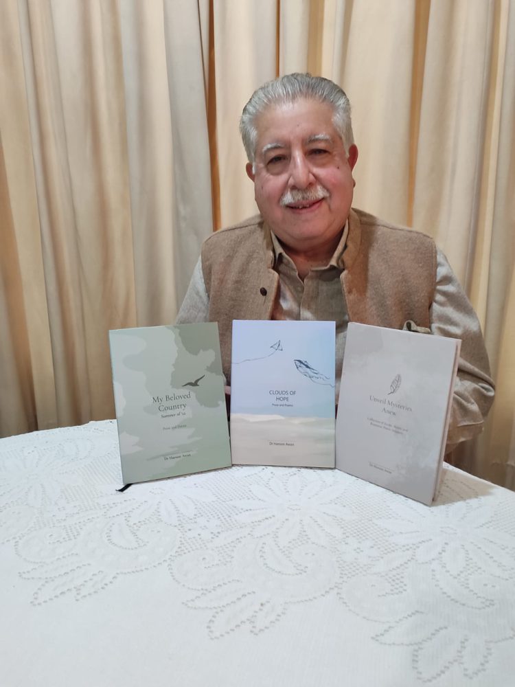 Dr Haroon Awan with all three of his collections.